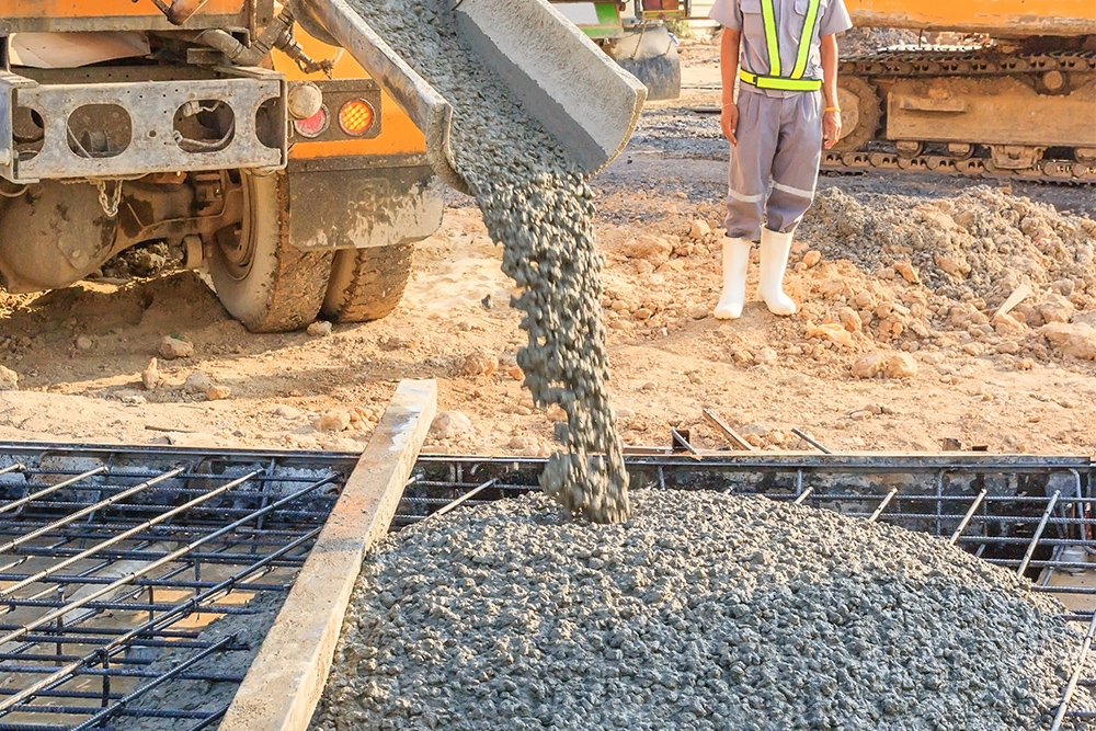 Concrete pouring during commercial concreting floors of building
